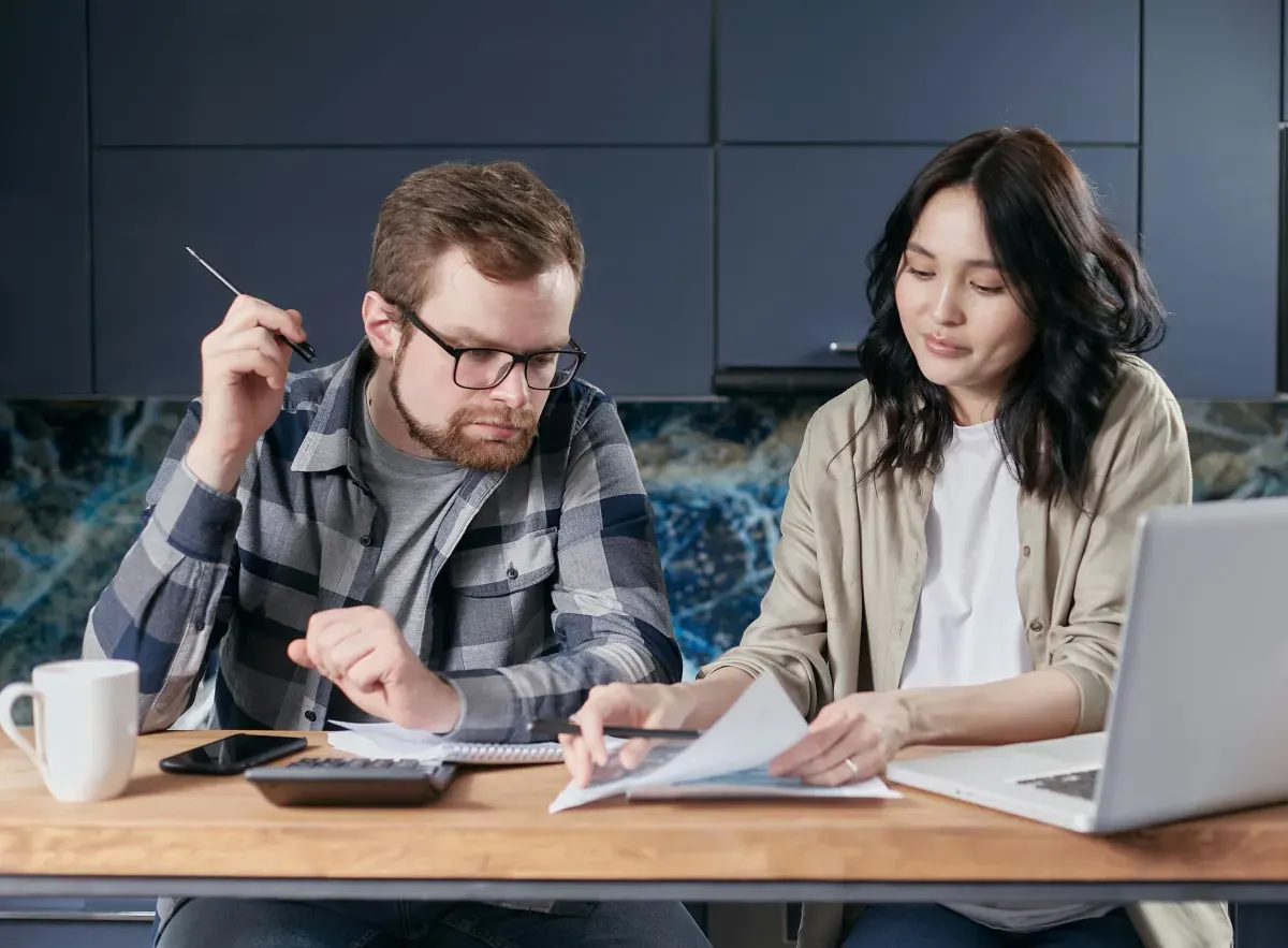Couple reviewing household costs and paperwork