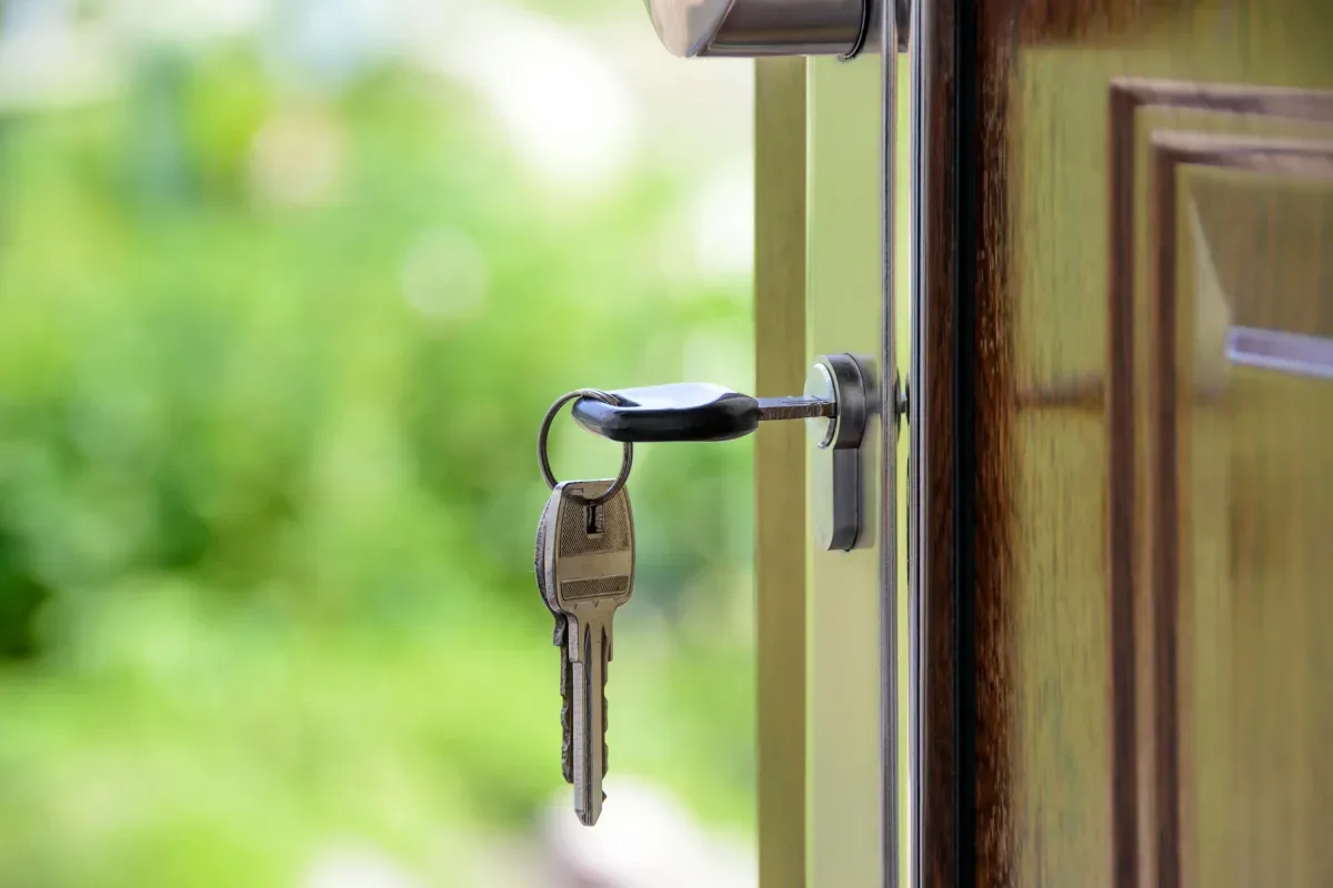 House key hanging from a door lock