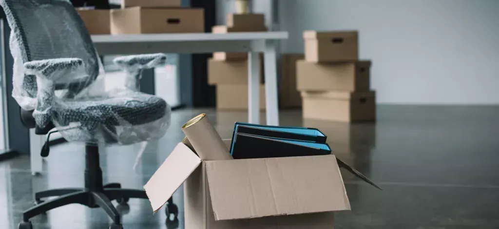 Office equipment and boxes prepared for moving
