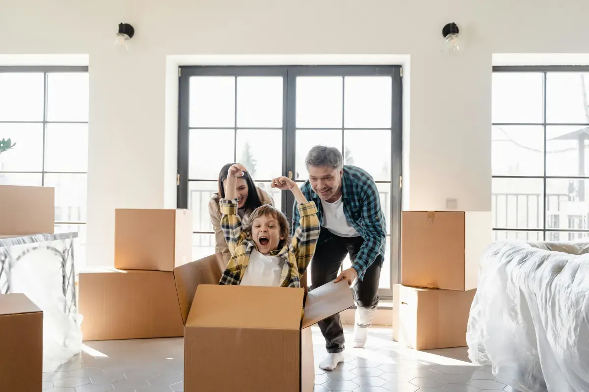 Family packing boxes at home