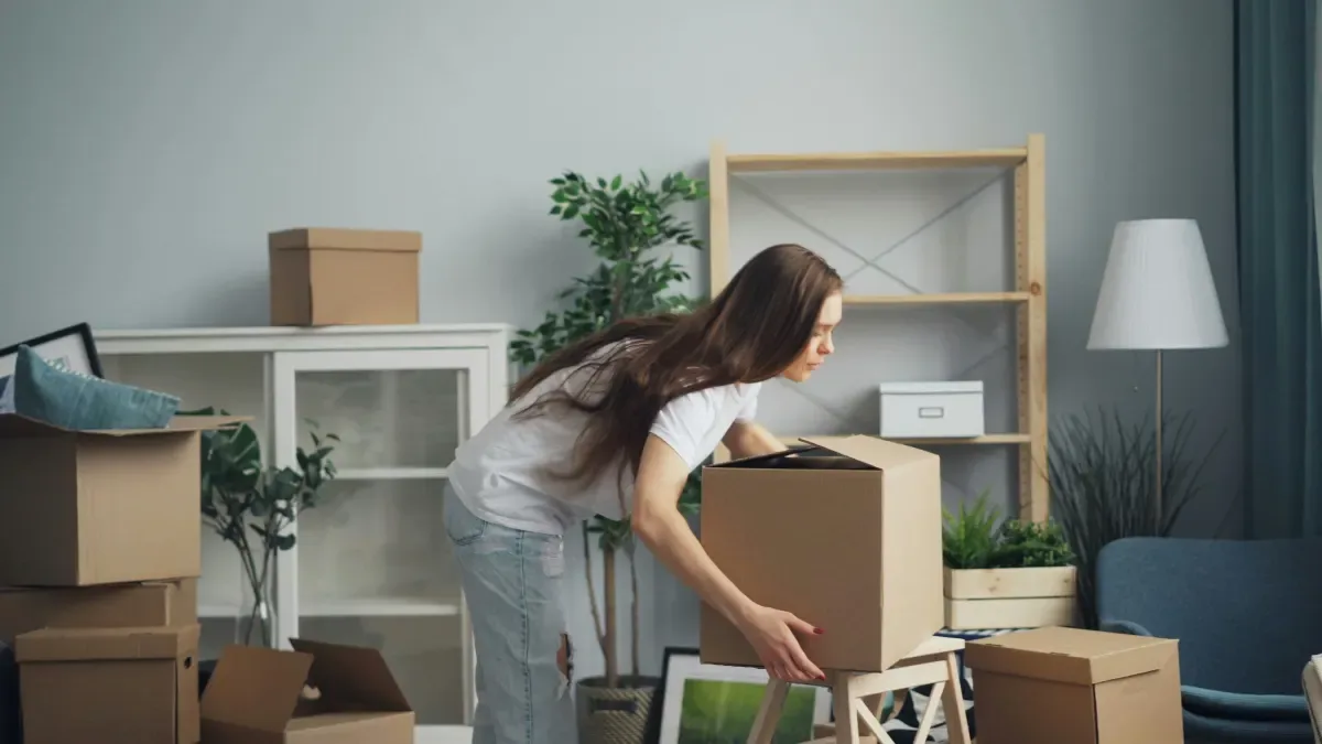 Person packing belongings at short notice