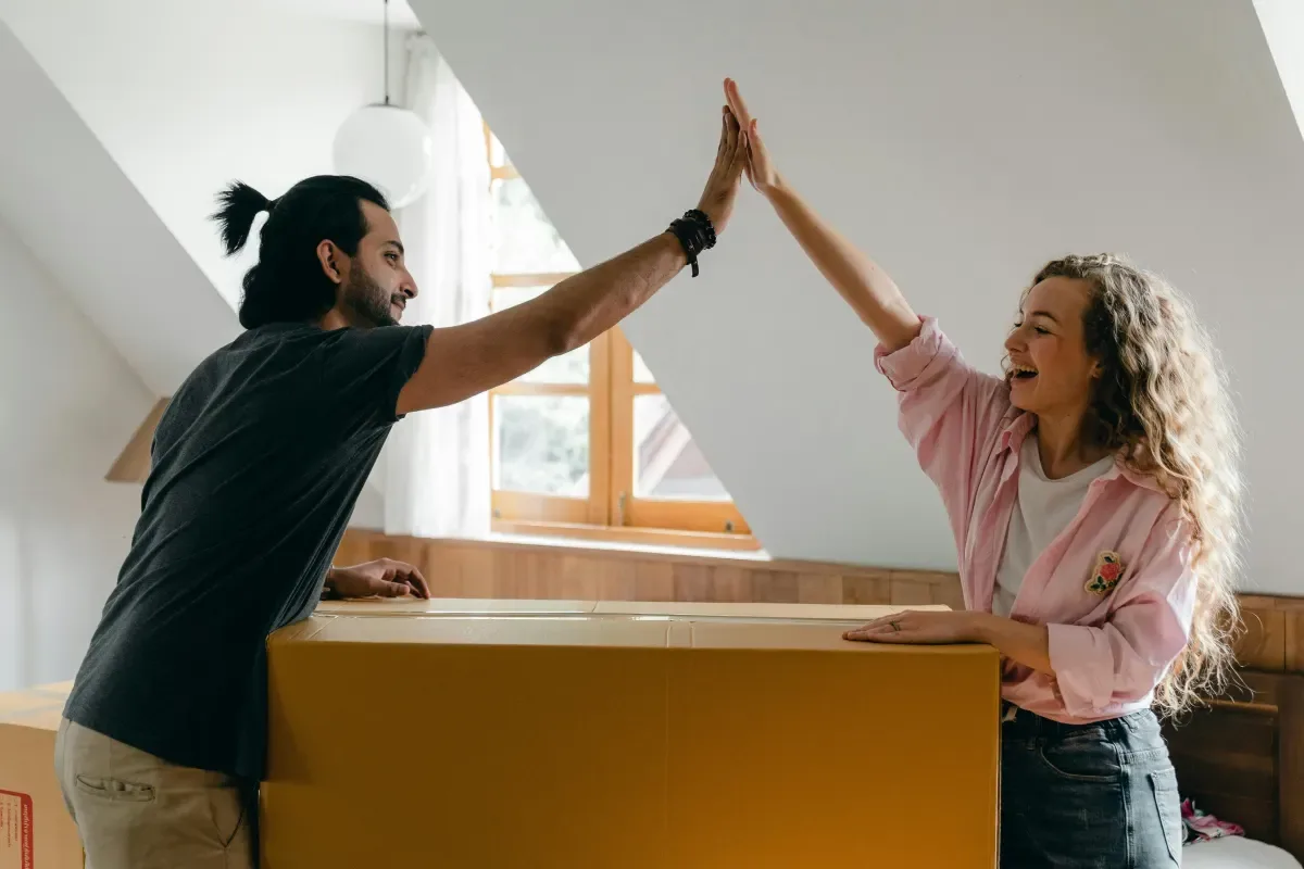 Couple celebrating their move into a new home