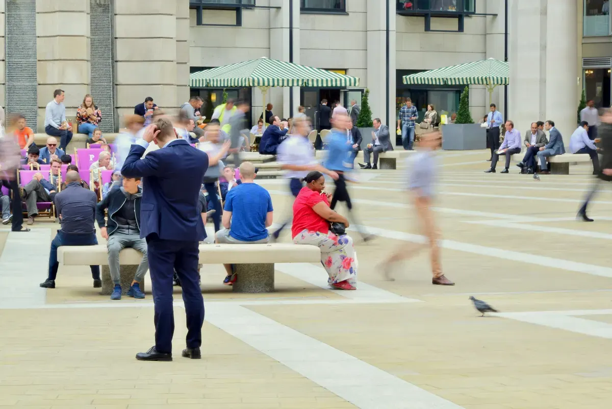 People walking through a London public square