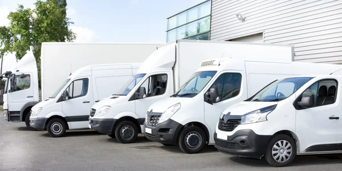 Different sizes of removal vans parked in a row