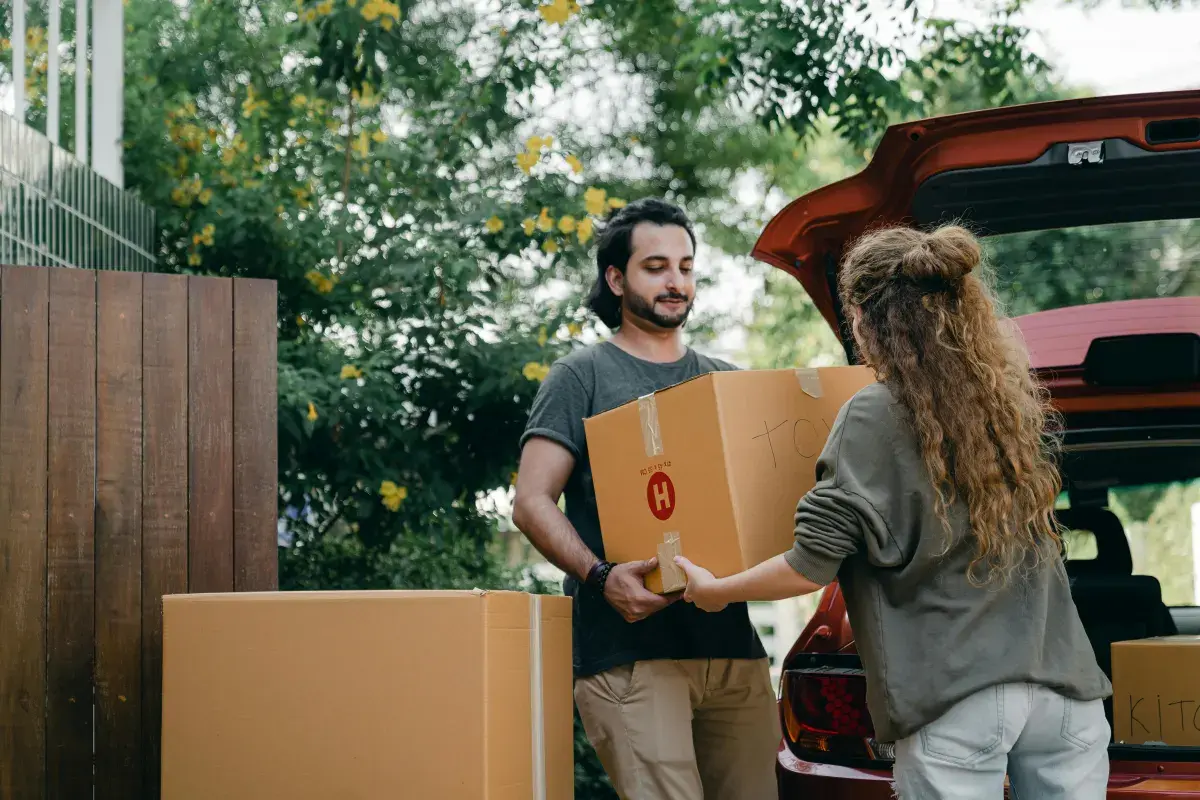 Couple packing a bag for moving day