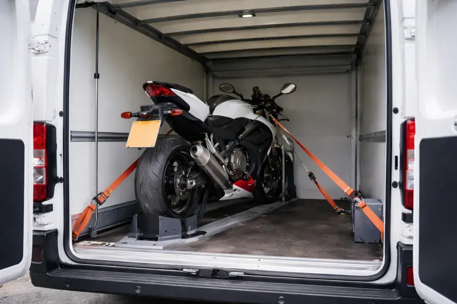 Motorcycle secured inside a transport van